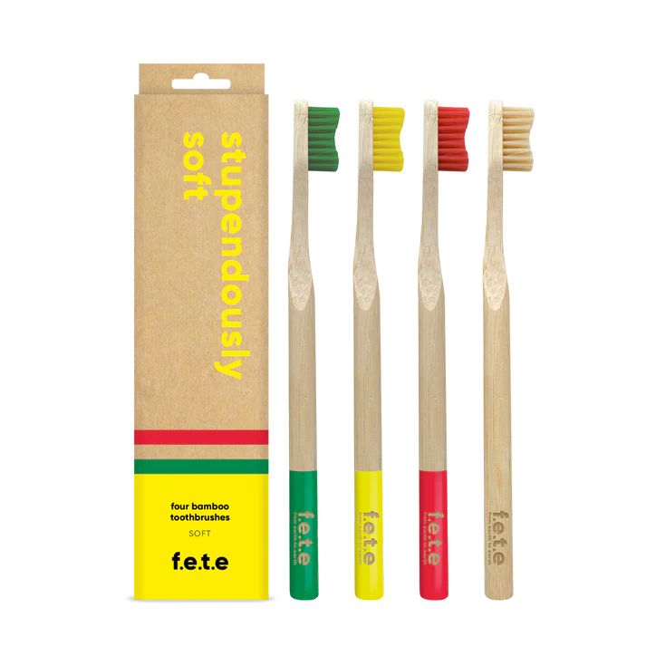 F.E.T.E. Multipack Soft Bamboo Toothbrushes Pack of 4 with colored bristles and tips, shown as a family pack next to a box labeled "stupendously soft," available at Fisa Health.