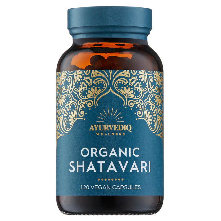 A brown glass bottle of Organic Shatavari 120 Vegan Capsules with a blue label featuring gold decorative patterns, available at Fisa Health.