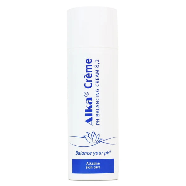 A white Alka Creme bottle by Alka features blue text, a leaf logo, and “alkaline crème” with pH 8.2 highlighted on the front, available at Fisa Health.