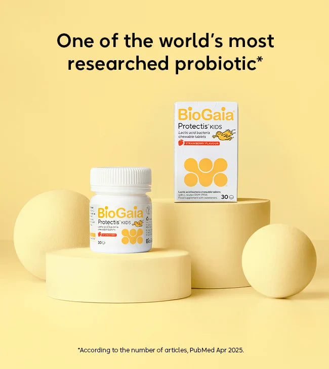 A bottle and box of BioGaia Protectis Strawberry Kids Tablets 30s displayed on yellow podiums, with the text "One of the world’s most researched probiotic*" above them, available at Fisa Health.