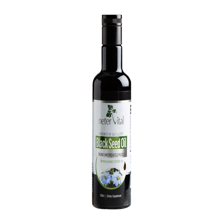 A dark glass bottle labeled "Black Seed Oil Cold-Pressed Nigella Sativa" with illustrations of Nigella sativa flowers on the label, available at Fisa Health.