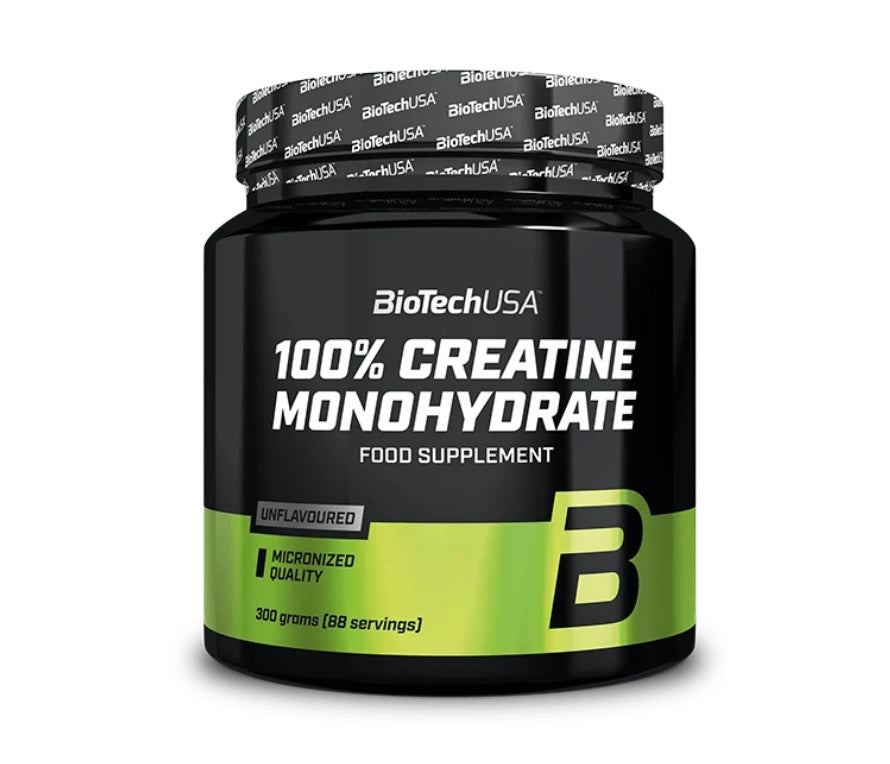 A black and green jar labeled BioTechUSA 100% Creatine Monohydrate 300g, unflavoured food supplement for sports nutrition, available at Fisa Health.