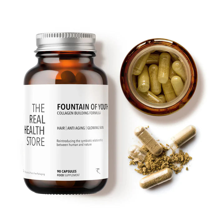 A bottle of Fountain Of Youth - Collagen Building Formula (90 capsules) is shown next to an open container on a neutral surface, available at Fisa Health.