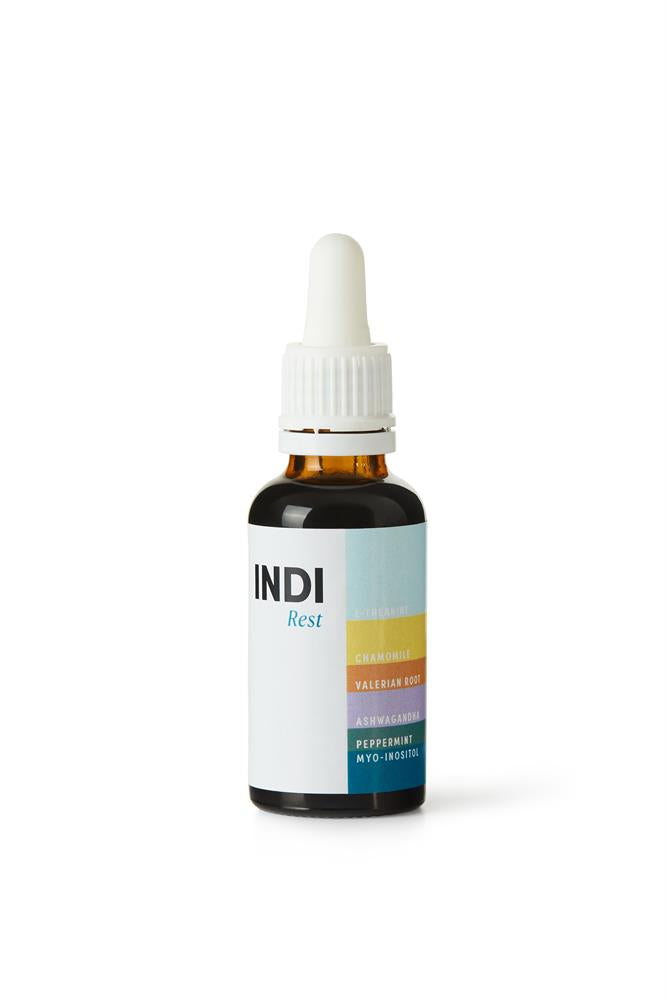 INDI Rest Natural Sleep Remedy 30ml in a brown glass dropper bottle, labeled with ingredients including chamomile, valerian root, ashwagandha, peppermint, and myo-inositol, available at Fisa Health.