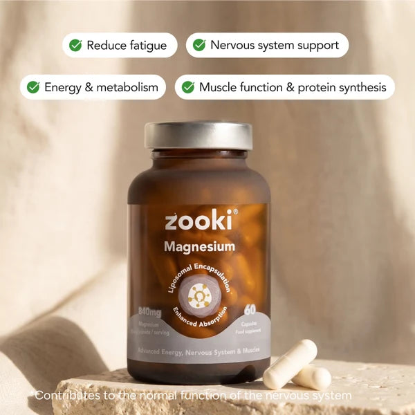 A bottle of Zooki Magnesium Bisglycinate 840mg 60 Capsules Liposomal resting on a stone surface, available at Fisa Health.