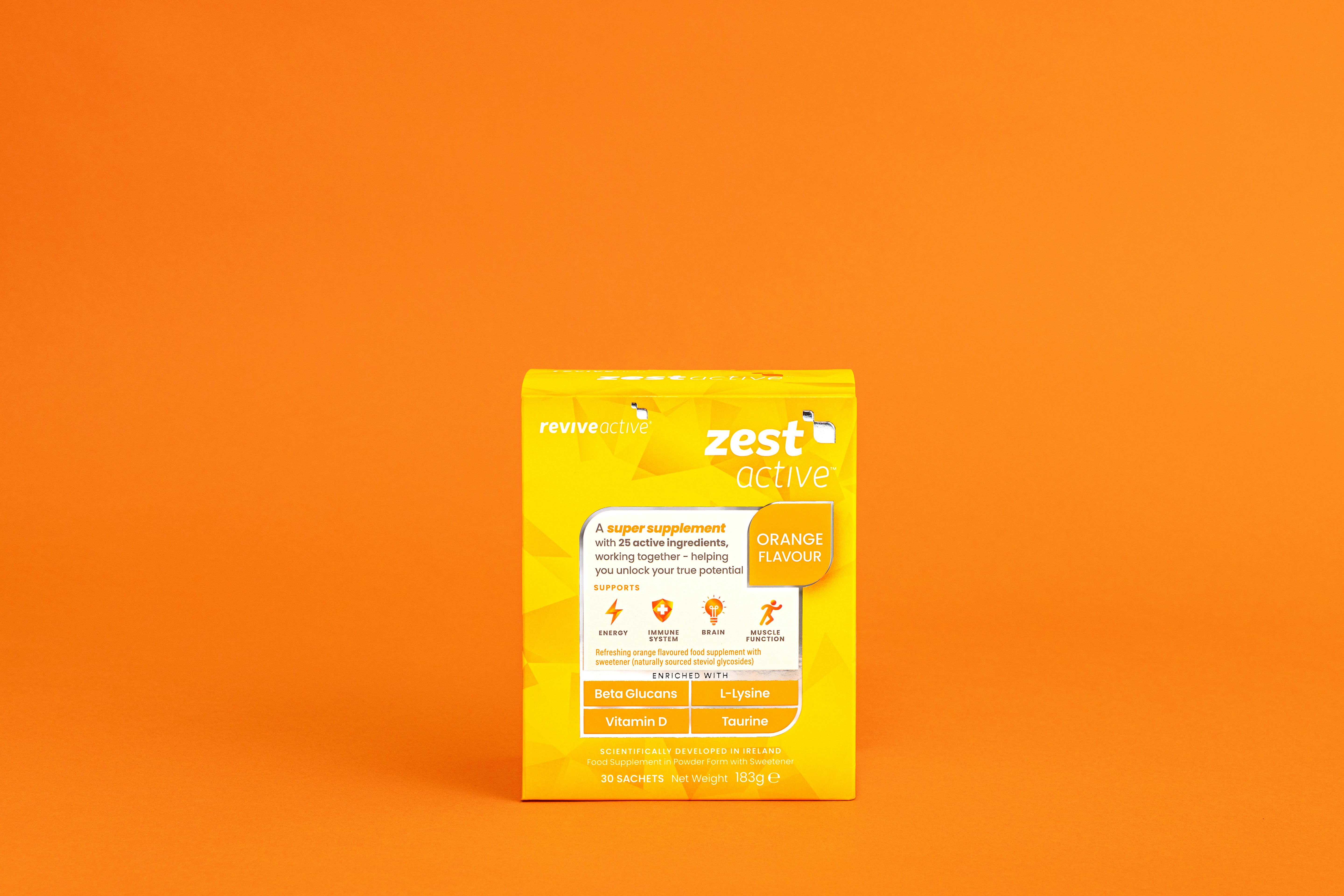 A yellow box labeled "Revive Zest Active - Orange" is centered on an orange background, with images of ingredients on the packaging. Available at Fisa Health.