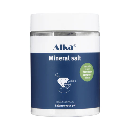 A blue-labeled Alka® Bath, mineral-rich salt for baths, soaks, and compresses; label indicates pH 8.5, available at Fisa Health.