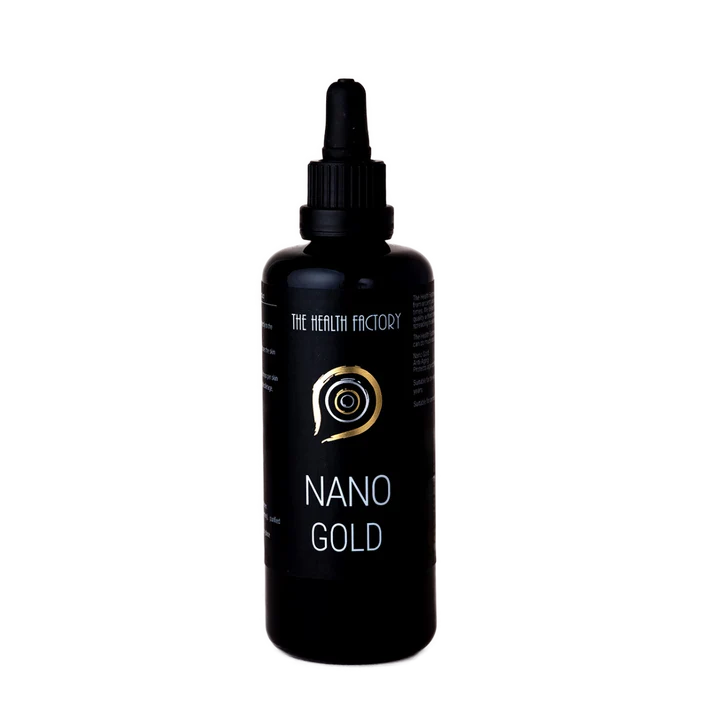 A dark violet glass bottle with a dropper cap and a label reading Nano Gold sits on a plain white background, available at Fisa Health.