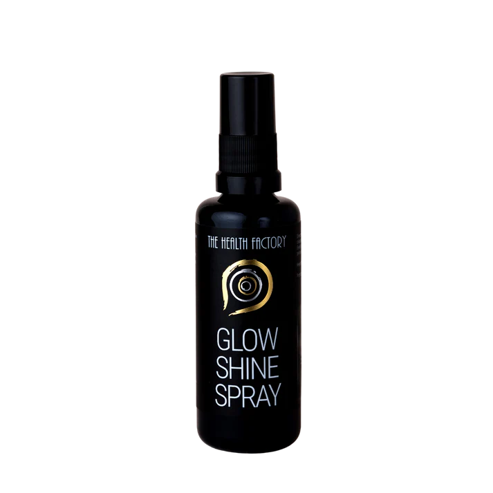 A black spray bottle labeled Glow & Shine Spray with a gold swirl design and the phrase "pure gold" on the front, available at Fisa Health.