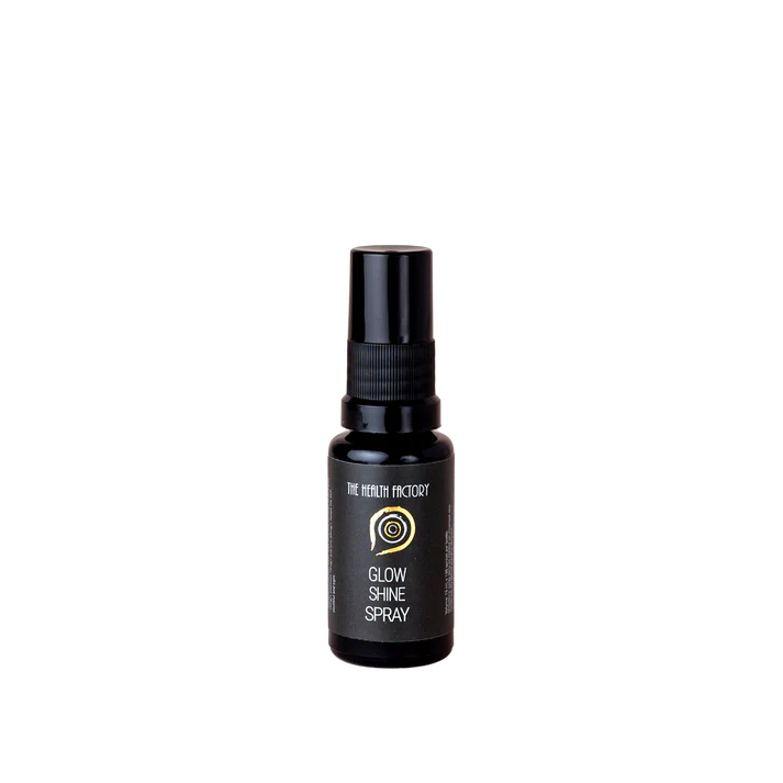 A small black spray bottle labeled "Glow & Shine Spray" is displayed on a plain white background, available at Fisa Health.