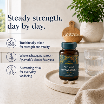 Ayurvediq Organic Ashwagandha With Black Pepper Extract 120 Vegan Capsules is placed next to water and leaves, with the text “Steady strength, day by day,” available at Fisa Health.