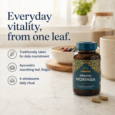 Ayurvediq Organic Moringa 120 Vegan Capsules are displayed on a counter, with the product bottle clearly visible, available at Fisa Health.