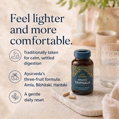 Ayurvediq Organic Triphala 120 Vegan Capsules with amla, bibhitaki, and haritaki in a bottle, shown beside a glass of water and several capsules, available at Fisa Health.