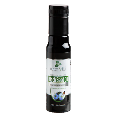 A 100ml bottle of Black Seed Oil Cold-Pressed Nigella Sativa with a black cap and a label featuring blue flowers and product information, available at Fisa Health.