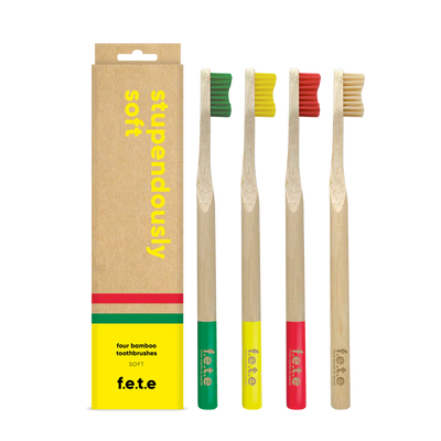 F.E.T.E. Multipack Soft Bamboo Toothbrushes Pack of 4 with colored bristles and tips, shown as a family pack next to a box labeled "stupendously soft," available at Fisa Health.