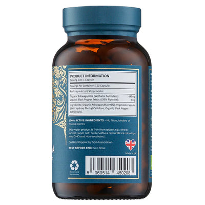 A brown bottle with a blue label displays Organic Ashwagandha With Black Pepper Extract 120 Vegan Capsules, product information, ingredients, barcode, recycling symbol, and UK flag; available at Fisa Health.