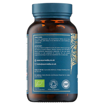 A brown bottle with a blue and gold label displays Organic Ashwagandha With Black Pepper Extract, 120 vegan capsules. The label shows instructions, warnings, logos, and a barcode, available at Fisa Health.