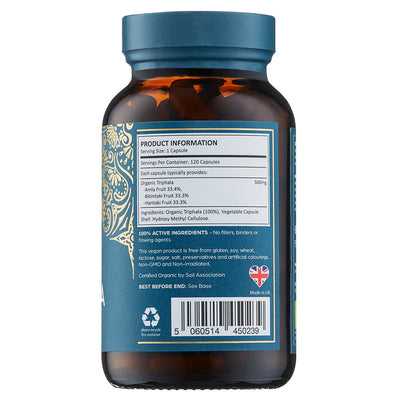 A brown bottle with a blue label displays supplement facts, ingredients, recycling symbols, a UK flag, barcode, and the Organic Triphala 120 Vegan Capsules product name, available at Fisa Health.