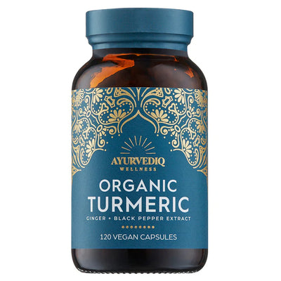A brown bottle with a label reading Organic Turmeric Ginger & Black Pepper Extract, 120 vegan capsules, featuring a blue and gold decorative design, available at Fisa Health.