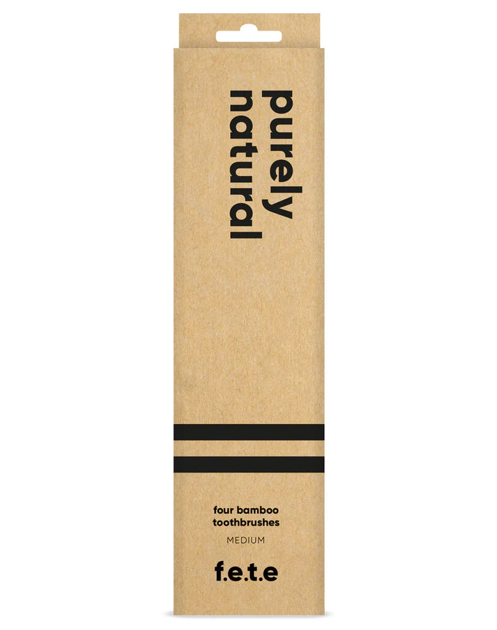 F.E.T.E. Natural Vegan Medium Bamboo Toothbrushes with charcoal bristles, pack of 4, in a brown box, available at Fisa Health.