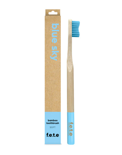 F.E.T.E. Single Soft Bamboo Toothbrush with blue bristles, a biodegradable handle, and eco-friendly Blue Sky packaging, available at Fisa Health.