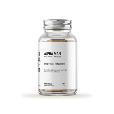 A clear bottle labeled Alpha Man (Multi Mineral, Testosterone & Libido Boosting) (90 Caps) contains beige capsules. The label features the words drive, focus, and testosterone support, available at Fisa Health.