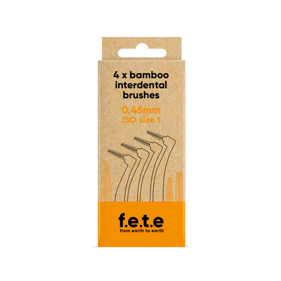 A cardboard box labeled "F.E.T.E. Bamboo Interdental Brushes, 0.45mm ISO size 1" displays line art of bamboo brushes on eco-friendly packaging, available at Fisa Health.