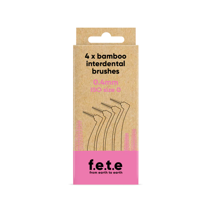 A cardboard box of F.E.T.E. Bamboo Interdental Brushes, 4-pack, 0.4mm ISO 0, featuring brush images and branding on a pink band, available at Fisa Health.
