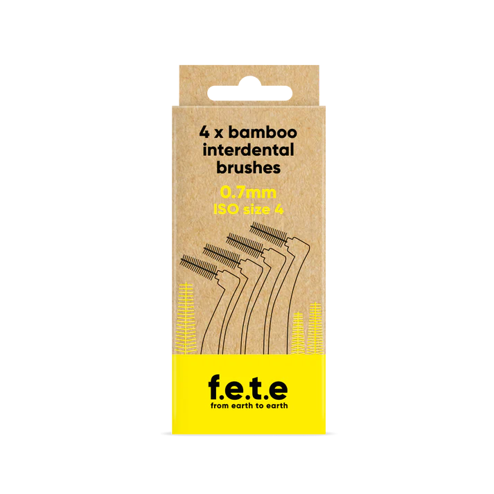 A cardboard box of F.E.T.E. Bamboo Interdental Brushes, 4 pack, 0.7mm ISO size 4, with eco-friendly branding and brush illustrations, available at Fisa Health.