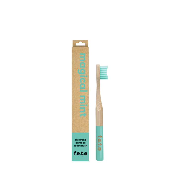 F.E.T.E. Children’s Bamboo Toothbrush with a mint green handle and bristles, shown alongside its brown and mint green "Magical Mint" box, available at Fisa Health.