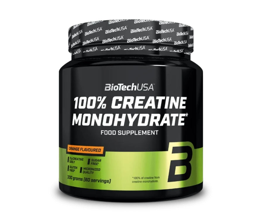 BioTechUSA 100% Creatine Monohydrate 300g in a black-green tub, orange flavor, 60 servings, available at Fisa Health.