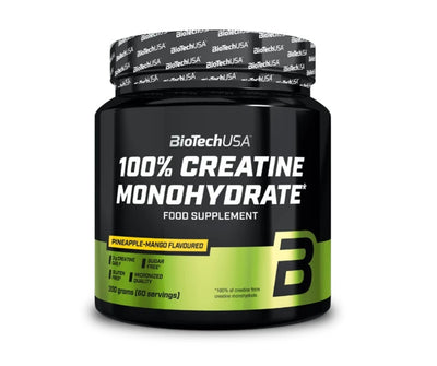 A 300g black tub of BioTechUSA 100% Creatine Monohydrate, pineapple-mango flavor, with a green-yellow label design and “60 servings” text, available at Fisa Health.