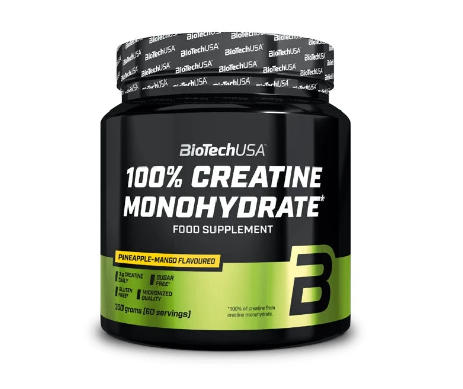 A 300g black tub of BioTechUSA 100% Creatine Monohydrate, pineapple-mango flavor, with a green-yellow label design and “60 servings” text, available at Fisa Health.