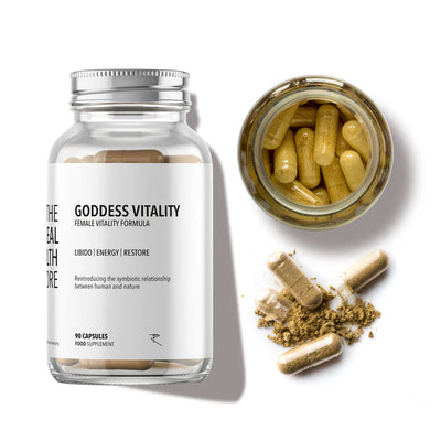 A bottle of Health Goddess - Female Vitality Formula (90 Caps) with Ayurvedic herbs for women is displayed next to an open jar and spilled powder on a white background, available at Fisa Health.
