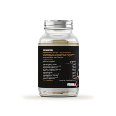 A clear bottle of Raw Sport Recover Immune Formula displays white capsules and a label with supplement facts and a Made in Britain logo, viewed from the back, available at Fisa Health.