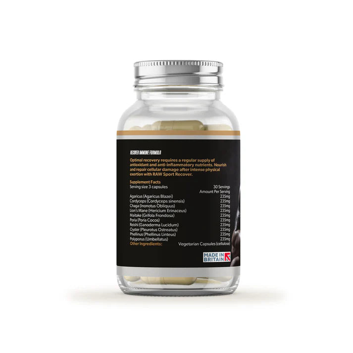 A clear bottle of Raw Sport Recover Immune Formula displays white capsules and a label with supplement facts and a Made in Britain logo, viewed from the back, available at Fisa Health.