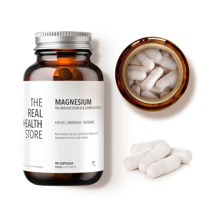 A brown glass bottle labeled Magnesium & Methylated B Vitamin Complex (90 Caps) is shown with several white capsules beside it, available at Fisa Health.