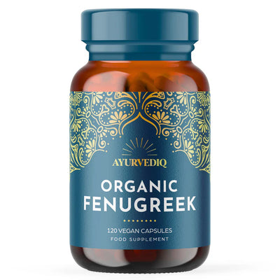 A brown bottle labeled Organic Fenugreek Capsules - 120 Capsules displays gold designs on a blue background and contains vegan capsules, available at Fisa Health.