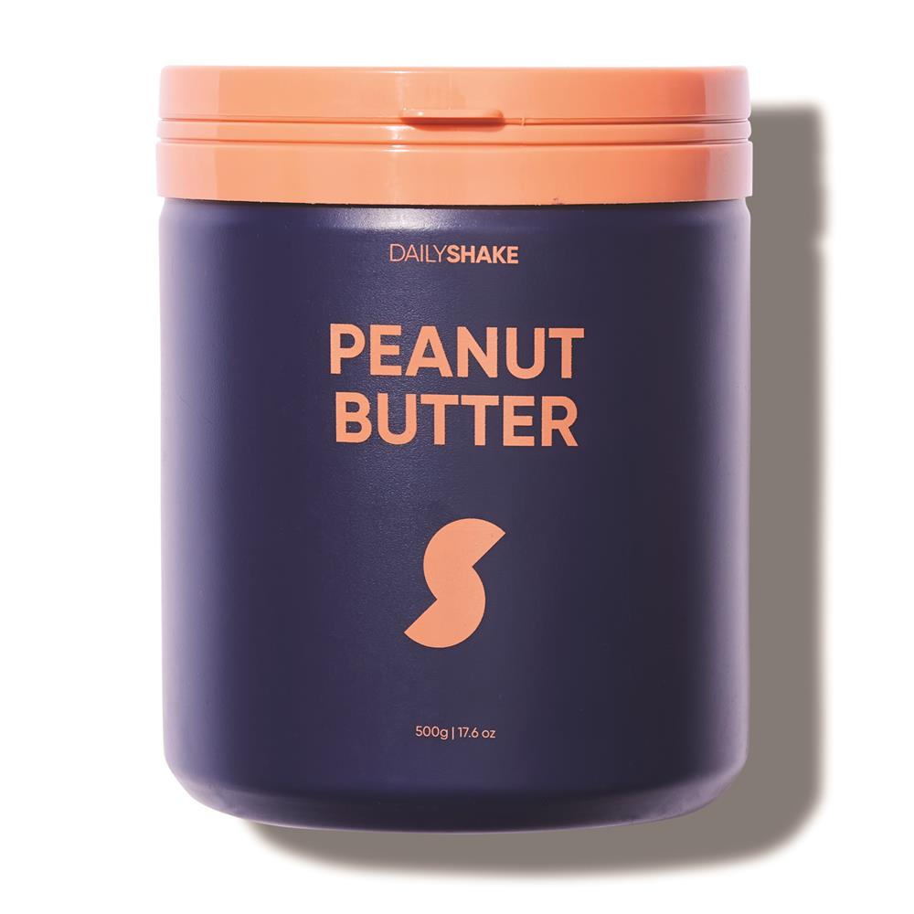 A dark blue Daily Shakes Peanut Butter Meal Replacement Jar, 500g, with an orange lid and label is shown with a shadow on the right side, available at Fisa Health.