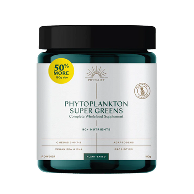 A jar of Phytoplankton Super Greens Powder 180g with omega-3, labeled “50% More” in yellow, white label with green accents, available at Fisa Health.