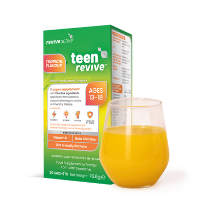 A box of Revive Active Teen Revive- Tropical Flavour is shown next to a glass containing an orange beverage, available at Fisa Health.
