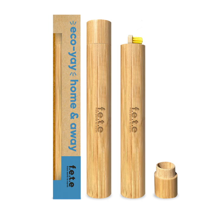 Three bamboo toothbrush holders are displayed, including the F.E.T.E. Bamboo Toothbrush Travel Case, with one holder containing a toothbrush, available at Fisa Health.