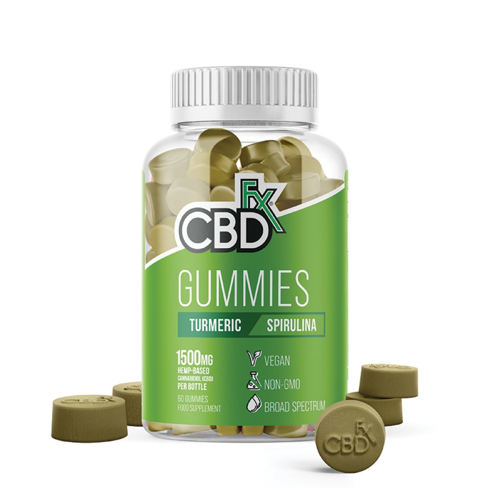 A bottle of CBDFX Turmeric & Spirulina Gummies (60ct / 1500mg CBD), vegan and non-GMO, with green gummies inside the bottle and a few scattered nearby, available at Fisa Health.