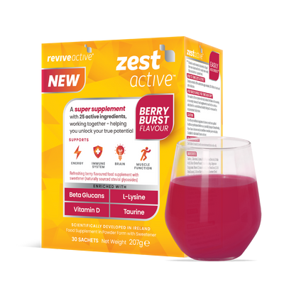 A box of Revive Zest Active- Berry Burst stands next to a bright pink drink, with its vitamins and minerals displayed in bold text on the packaging, available at Fisa Health.