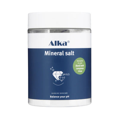 A blue-labeled Alka® Bath, mineral-rich salt for baths, soaks, and compresses; label indicates pH 8.5, available at Fisa Health.