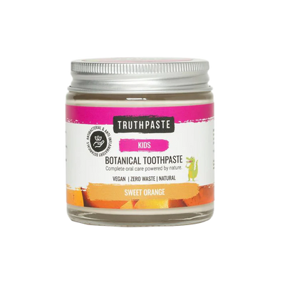 A glass jar of Truthpaste Children’s Truthpaste, Sweet Orange flavor, with a colorful label featuring a small cartoon dinosaur, available at Fisa Health.