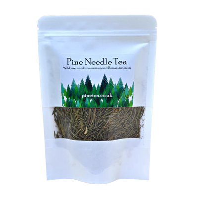 A white Pinetea pouch containing dried pine needles, featuring pine tree graphics and the pinetea.co.uk website on the label, available at Fisa Health.