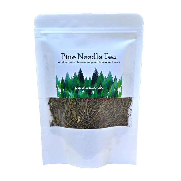 A white Pinetea pouch containing dried pine needles, featuring pine tree graphics and the pinetea.co.uk website on the label, available at Fisa Health.