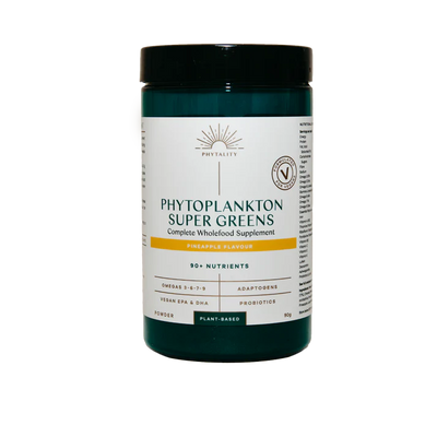 A container of Phytoplankton Super Greens Powder 90g, pineapple flavour, featuring 90+ listed nutrients and vegan probiotics, on a white background, available at Fisa Health.