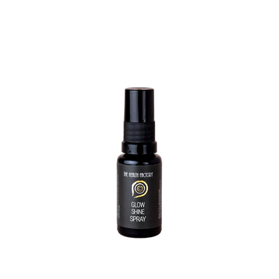 A small black spray bottle labeled "Glow & Shine Spray" is displayed on a plain white background, available at Fisa Health.